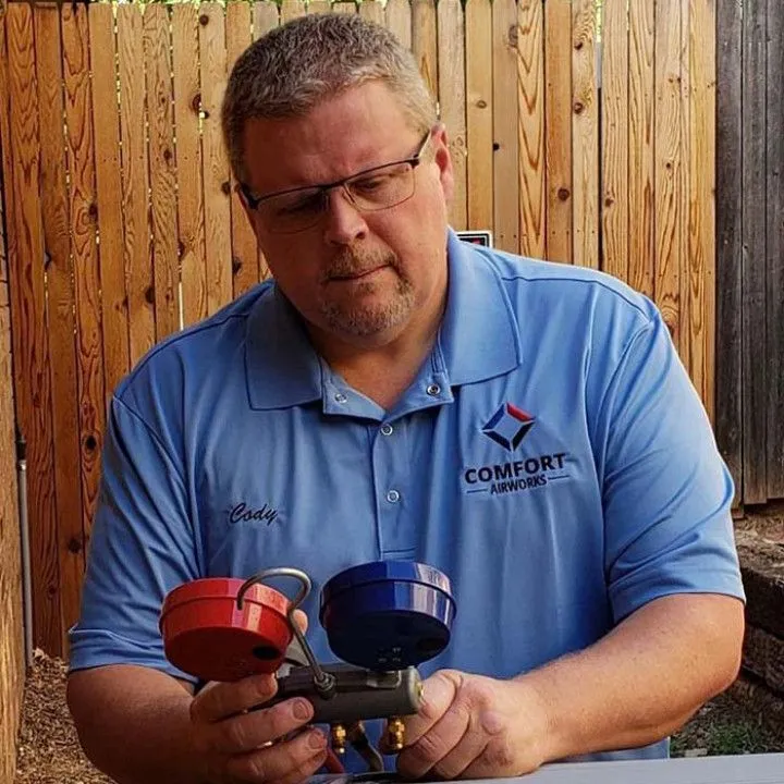 Comfort Airworks technician checking refrigerant gauges